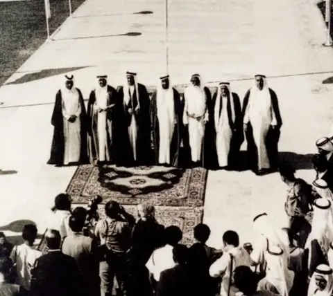 The same photograph cropped to the Rulers on the carpet.